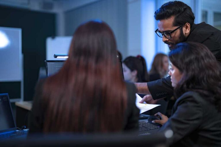 In a 24 7 Security Operations Center, a diverse incident response team works together under pressure, analyzing real-time threat intelligence data to defend against a live cyberattack.